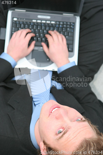 Image of Businessman working on laptop