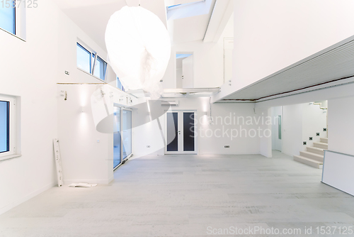 Image of Interior of empty stylish modern open space two level apartment