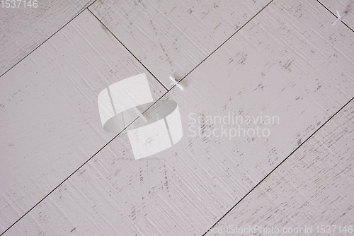 Image of Ceramic wood effect tiles and tools for tiler on the floor