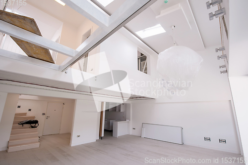 Image of Interior of empty stylish modern open space two level apartment