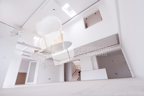 Image of Interior of empty stylish modern open space two level apartment