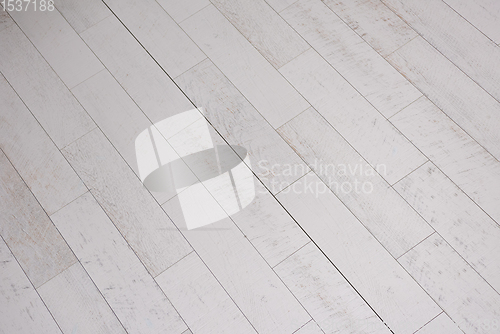 Image of Ceramic wood effect tiles and tools for tiler on the floor