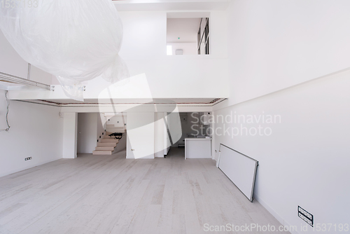 Image of Interior of empty stylish modern open space two level apartment