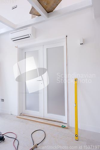 Image of double glass door with white wooden frame