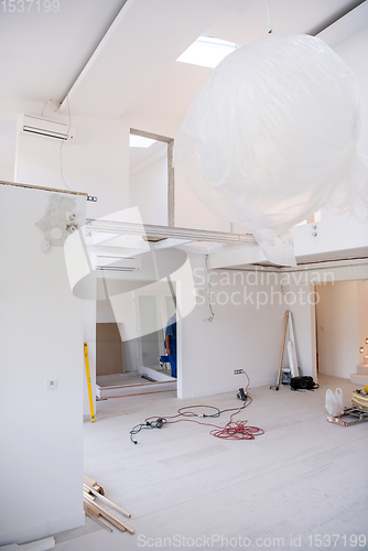 Image of carpenters installing glass door with a wooden frame