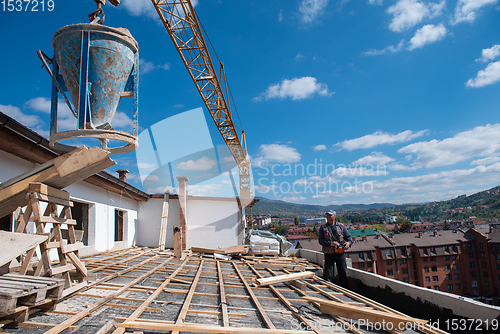 Image of Construction worker installing a new roof