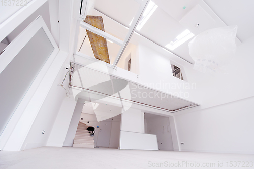 Image of Interior of empty stylish modern open space two level apartment