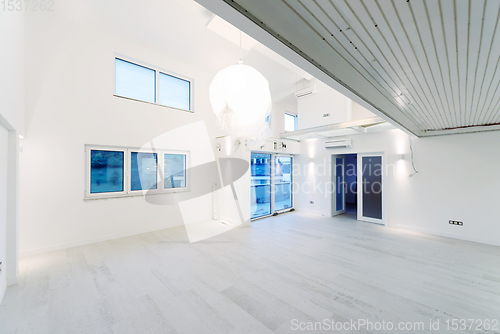 Image of Interior of empty stylish modern open space two level apartment