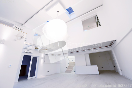 Image of Interior of empty stylish modern open space two level apartment