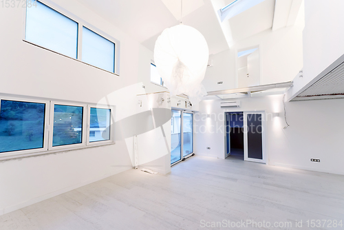 Image of Interior of empty stylish modern open space two level apartment