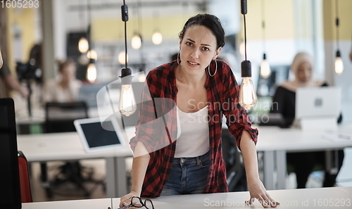 Image of at work  in creative modern coworking startup open space office