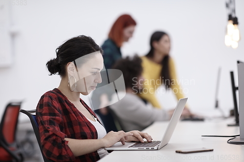 Image of at work  in creative modern coworking startup open space office