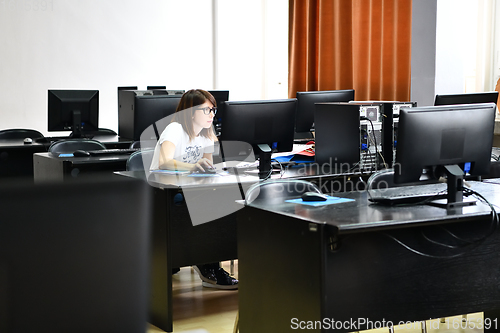 Image of one student in computers classroom