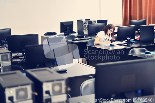 Image of one student in computers classroom