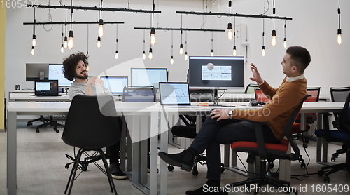 Image of friends at office playing with stress control ball