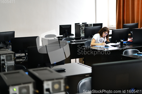 Image of one student in computers classroom