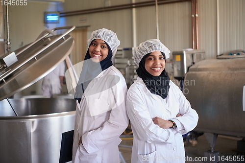 Image of business woman team in local cheese production company