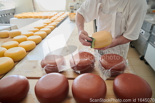 Image of Cheese maker at local production factory