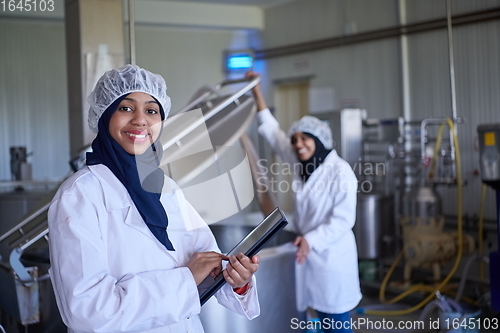 Image of business woman team in local cheese production company