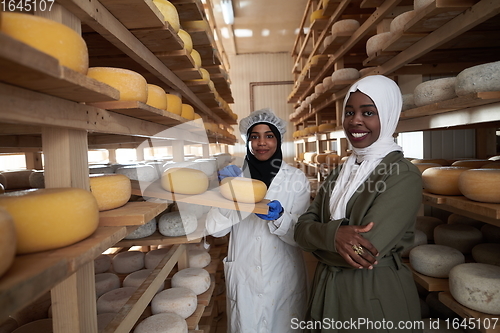 Image of business woman team in local cheese production company