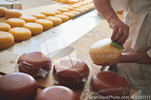 Image of Cheese maker at local production factory