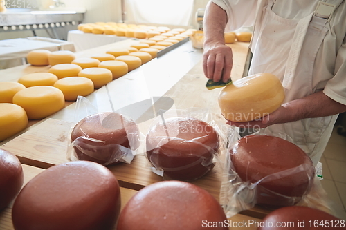 Image of Cheese maker at local production factory