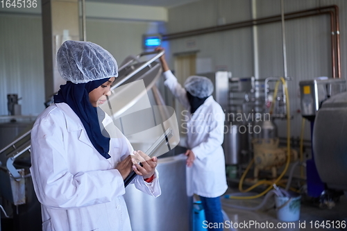 Image of business woman team in local cheese production company