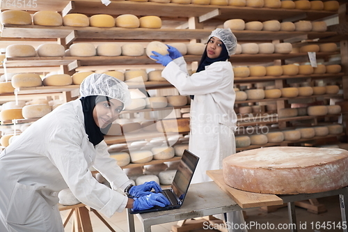 Image of business woman team in local cheese production company