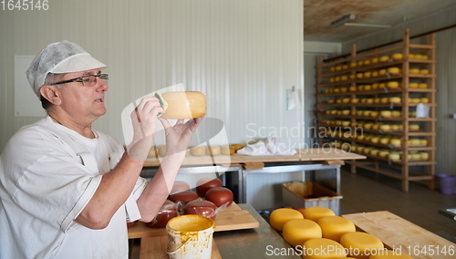 Image of Cheese maker at local production factory