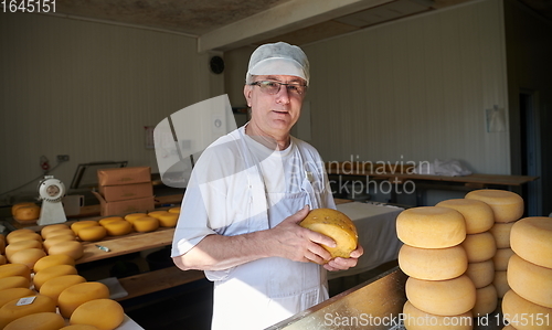 Image of Cheese maker at local production factory