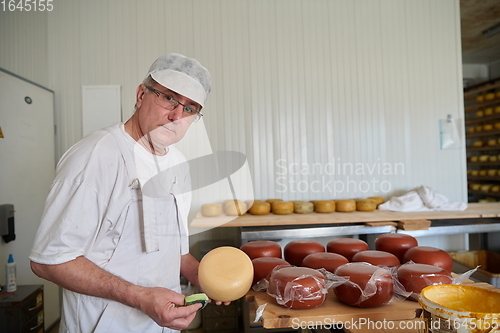 Image of Cheese maker at local production factory