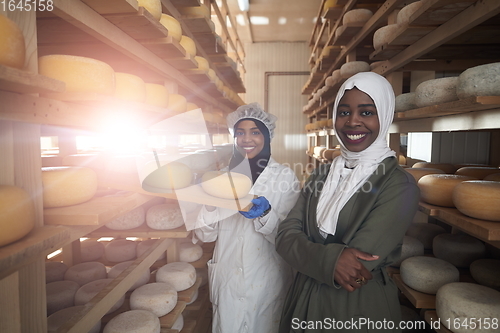 Image of business woman team in local cheese production company