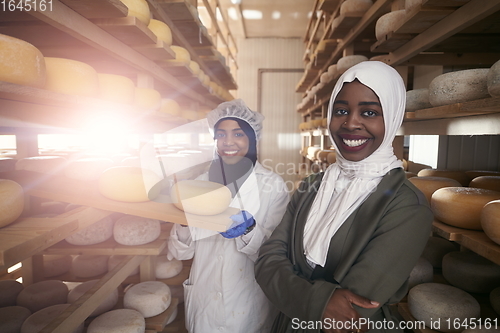 Image of business woman team in local cheese production company