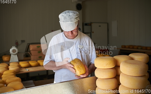 Image of Cheese maker at local production factory