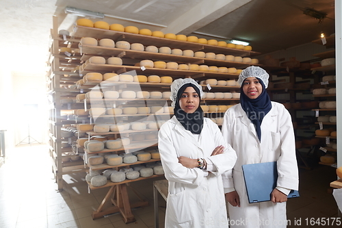 Image of business woman team in local cheese production company