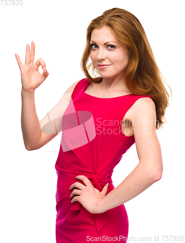 Image of Woman is showing OK sign