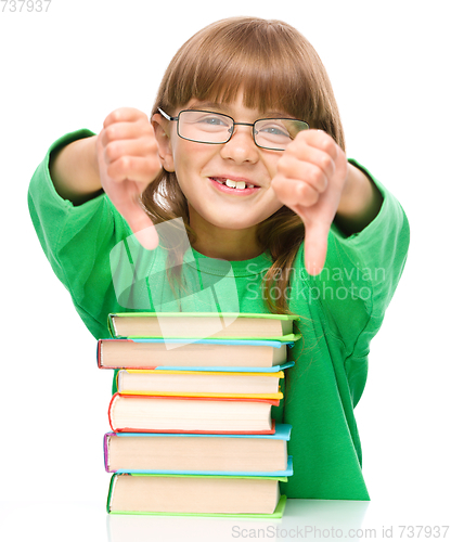 Image of Little girl is reading a book