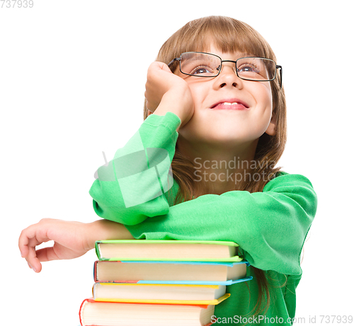 Image of Little girl is reading a book