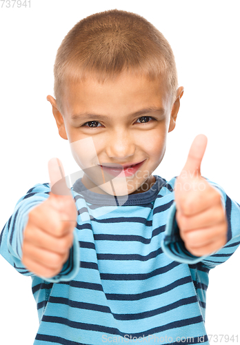 Image of Portrait of a cute boy showing thumb up sign