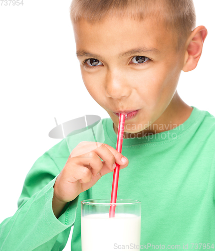 Image of Cute little boy with a glass of milk