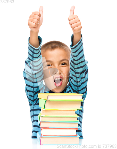 Image of Little boy is reading a book
