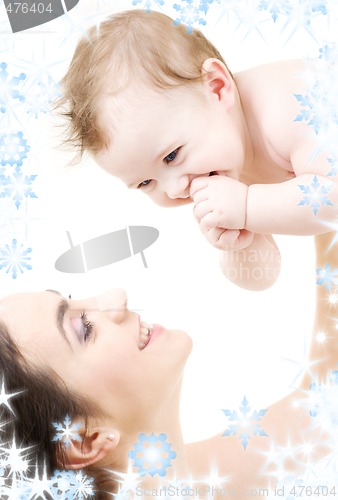 Image of laughing blue-eyed baby playing with mom