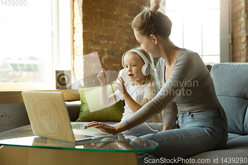 Image of Teacher and little girl, or mom and daughter. Homeschooling concept