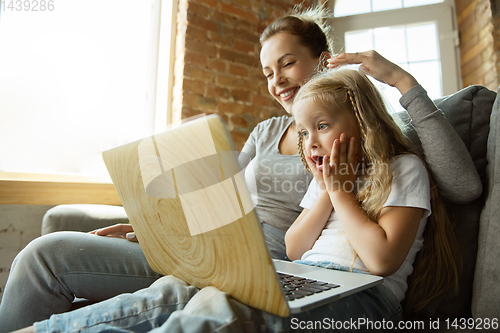 Image of Teacher and little girl, or mom and daughter. Homeschooling concept