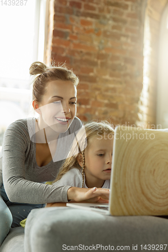 Image of Teacher and little girl, or mom and daughter. Homeschooling concept