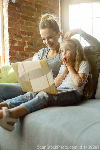 Image of Teacher and little girl, or mom and daughter. Homeschooling concept