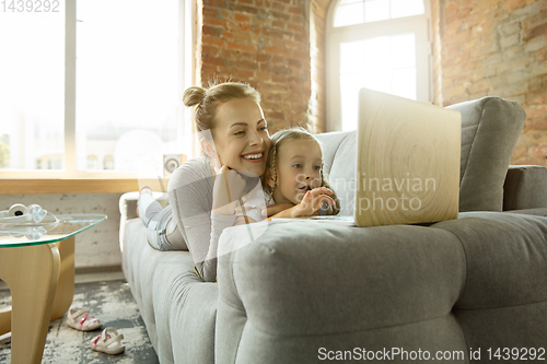 Image of Teacher and little girl, or mom and daughter. Homeschooling concept