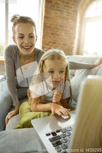 Image of Teacher and little girl, or mom and daughter. Homeschooling concept