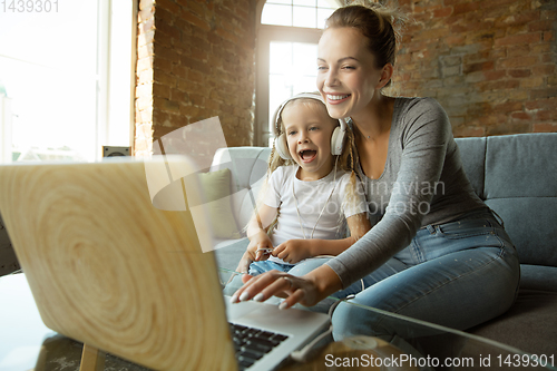 Image of Teacher and little girl, or mom and daughter. Homeschooling concept