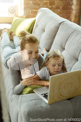 Image of Teacher and little girl, or mom and daughter. Homeschooling concept